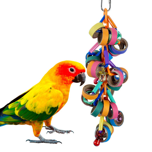 A colorful hanging bird toy with paper rings and a chain of pacifiers for shredding, featuring a yellow bird with a red head looking at it.