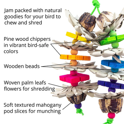 Bird toy with pine wood chippers, wooden beads, woven palm leaves, and mahogany pod slices on a white background.