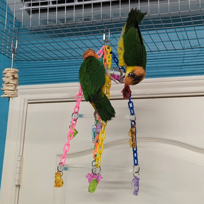 Two caiques climb up and down on the Treetop Chandelier Bird Toy.