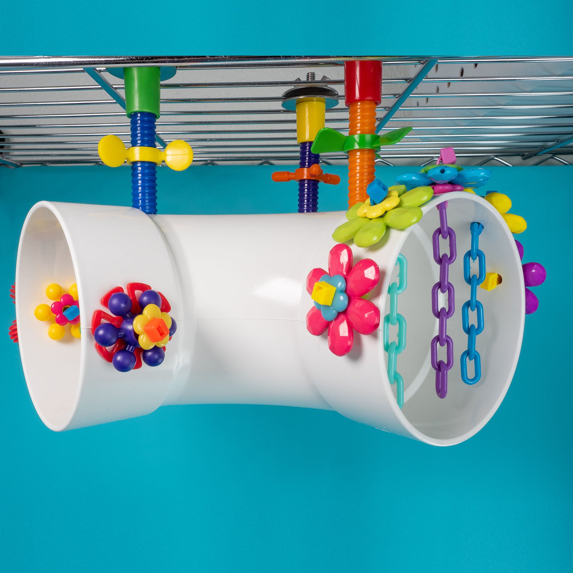 Colorful bird toy with tunnels and interactive elements. Hangs from the inside top of cage.