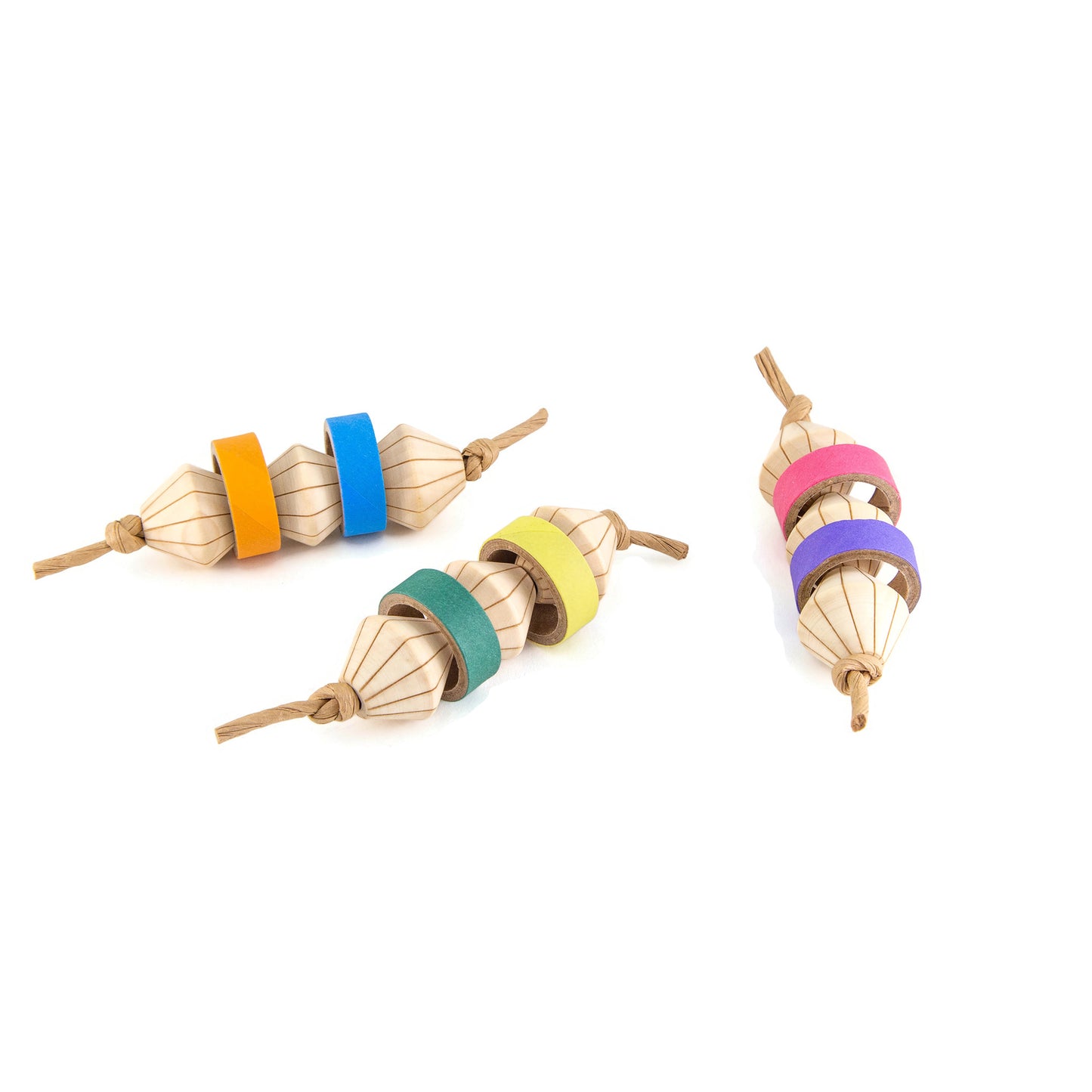Three wooden bird toys with colorful birdie bagels on a white background