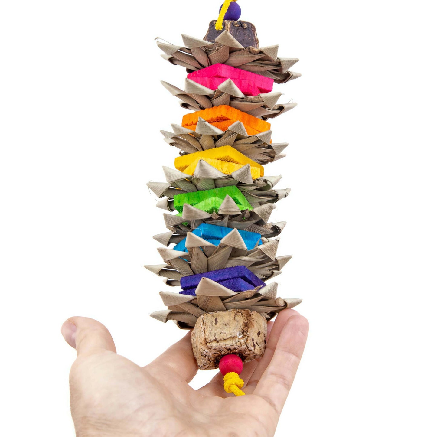 Colorful bird toy with rainbow colored chippers alternating with palm leaf flowers.