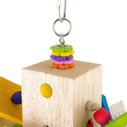Colorful beaded charm on a wooden block with a white background