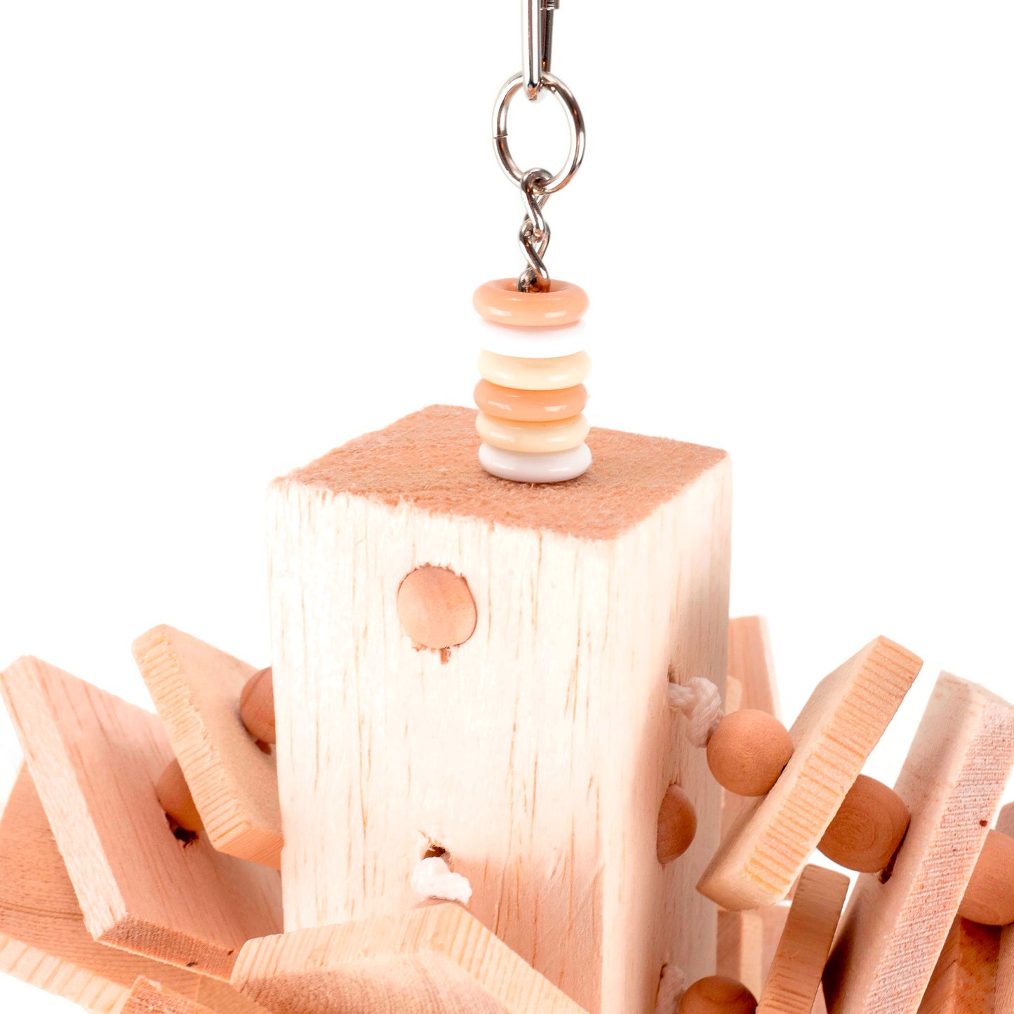 Chunky block of balsa suspended from a chain, embedded with beads and strung with additional balsa and pine pieces.