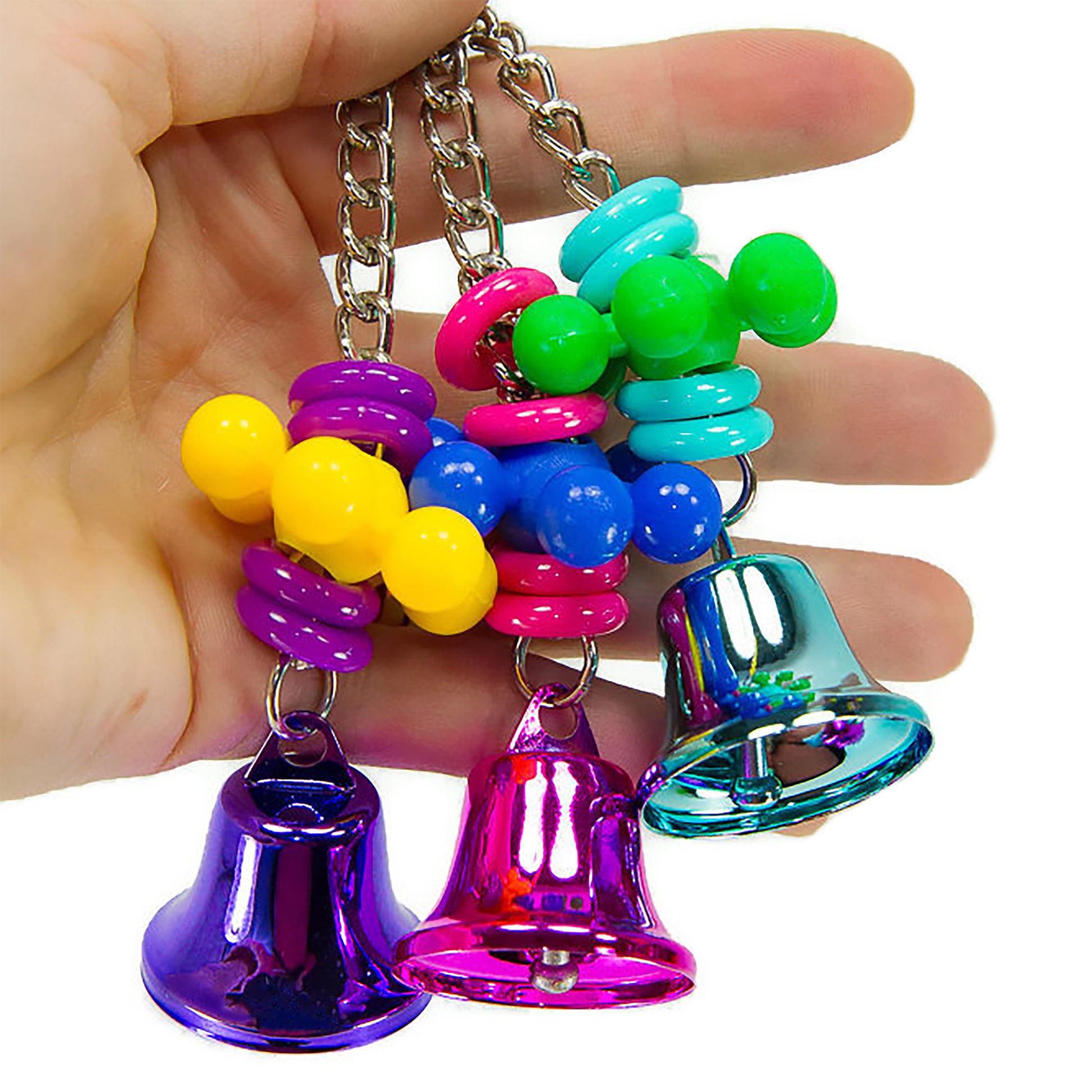Colorful bird toy with bells and plastic wheels held in woman's hand for size comparison.