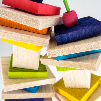 A close up of the bird toy reveals the fine grain texture of the balsa and the expertly smoothed texture of the pine wood.