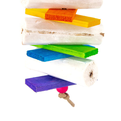 The bird toy features soft cream colored sola sticks and brightly colored balsa, each piece is colored separately to produce a rainbow of colors.