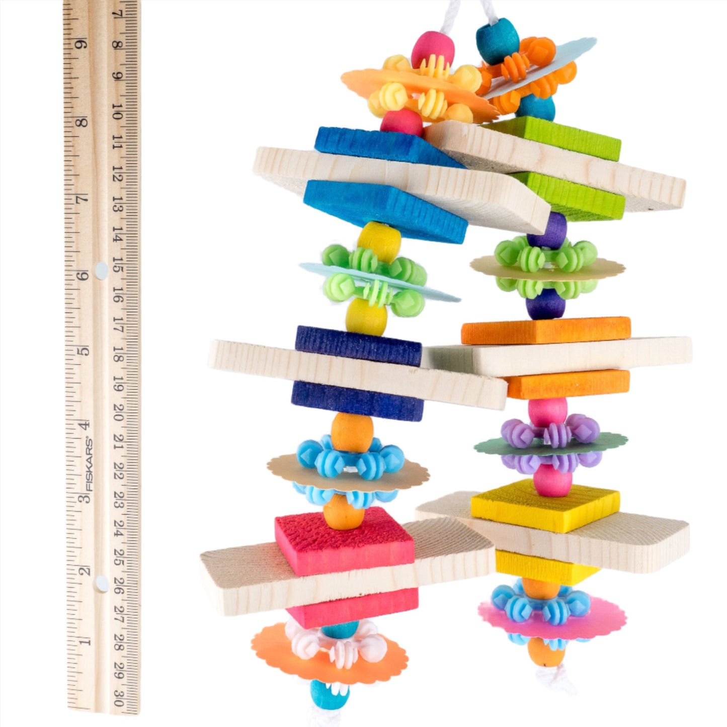 Starry eyed bird toy shown next to a ruler about 9 1/2 inches long.