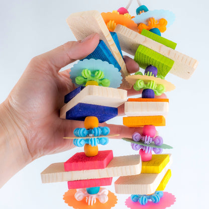 Bird Toy shown in hand for scale.